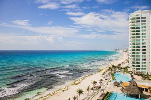 A local organization works to clean up Cancun’s Malecon Tajamar beach trash