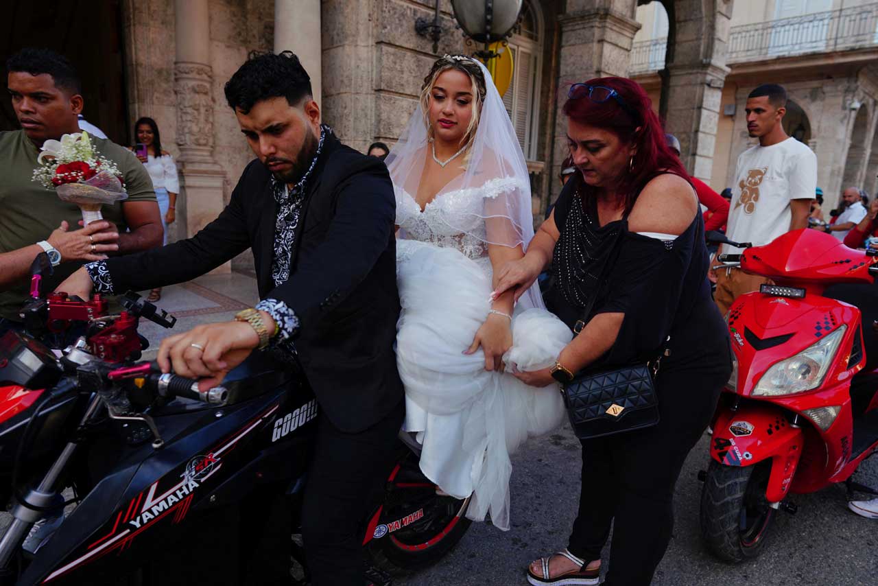 Electricity in the air for one Cuban couple’s two-wheeler wedding procession